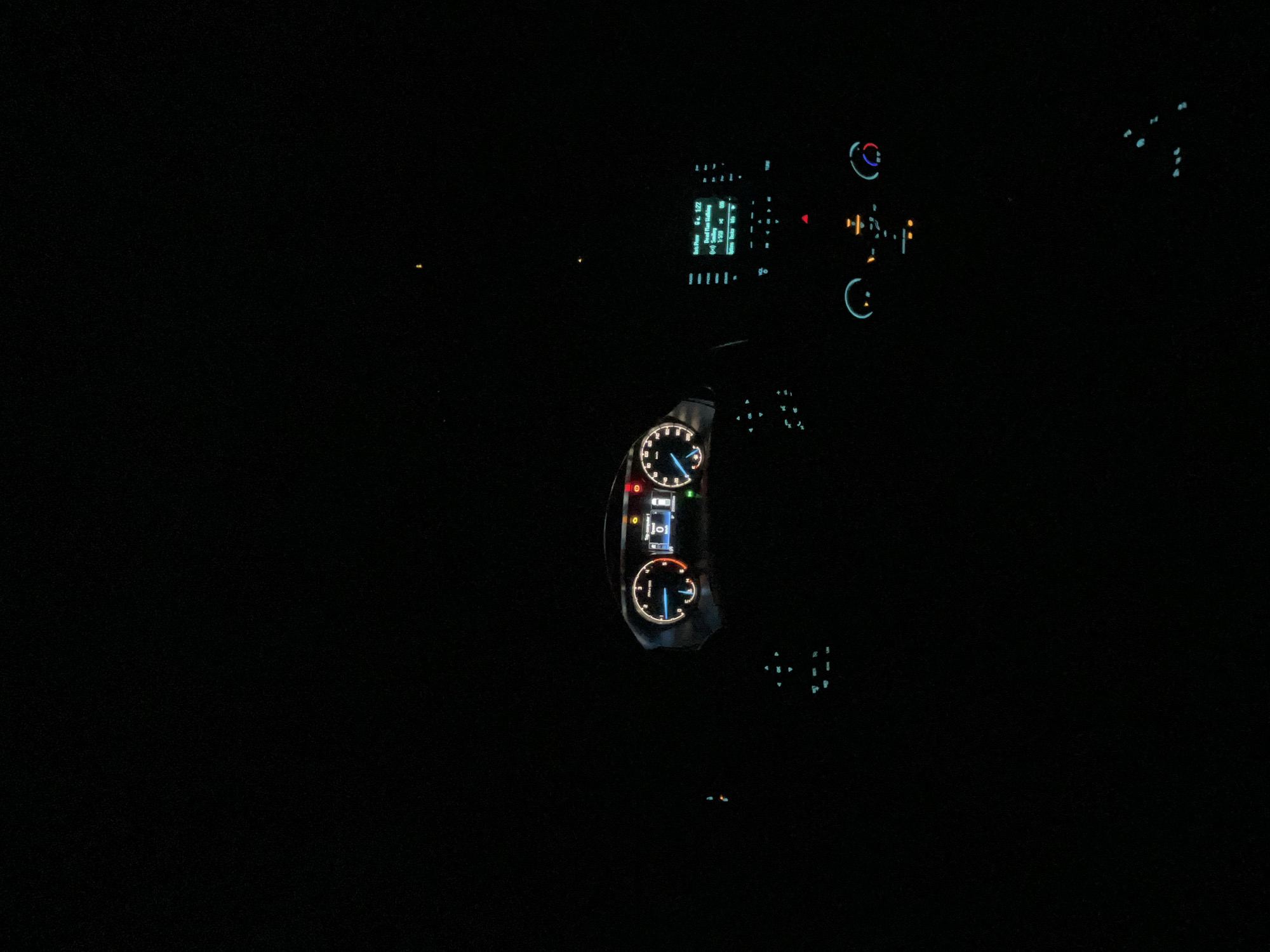 The image shows the interior of a vehicle at night. The dashboard is visible, illuminated by its instrument panel, including gauges and a digital display. The location is not discernible as there are no discernible features to indicate Varbeshnitsa, Bulgaria.