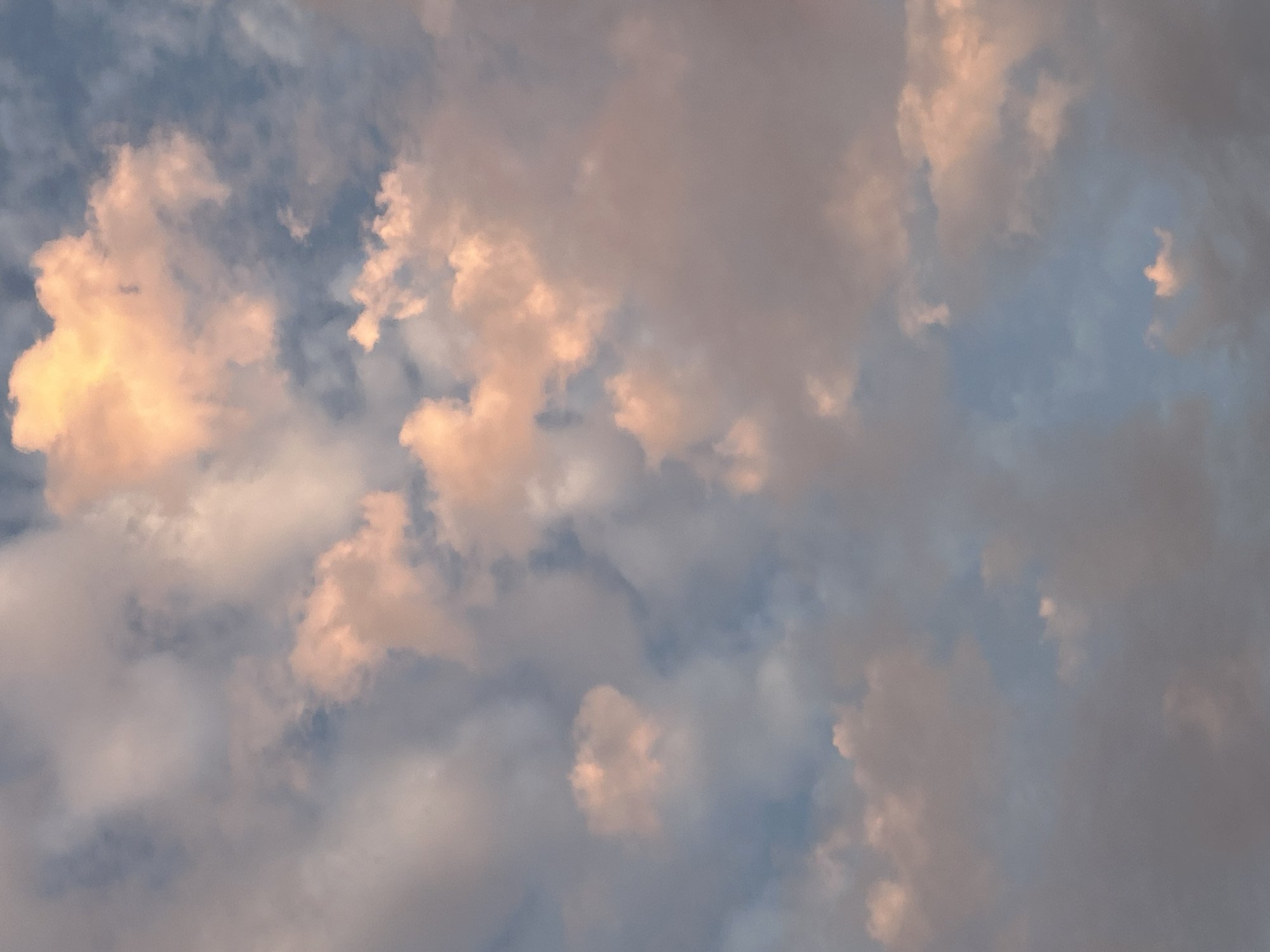 A sky view featuring scattered clouds, tinged with hues of pink and orange, against a backdrop of a pale blue sky. The image does not depict any urban landscape, specific location within Plovdiv, or any identifiable subjects or actions.