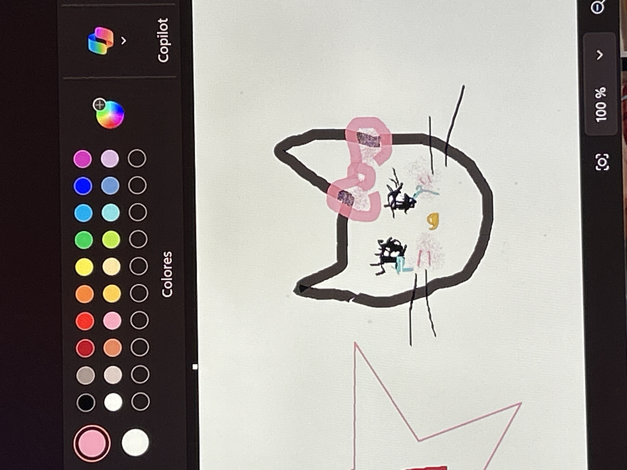A digital drawing of Hello Kitty with a pink bow is displayed on a tablet screen. The drawing is incomplete, with features such as eyes and whiskers crudely sketched. Below the cat's head, a partial outline of a star shape is visible. The tablet screen also shows a color palette on the left side. The drawing appears to be created digitally. The location is not evident from the image.