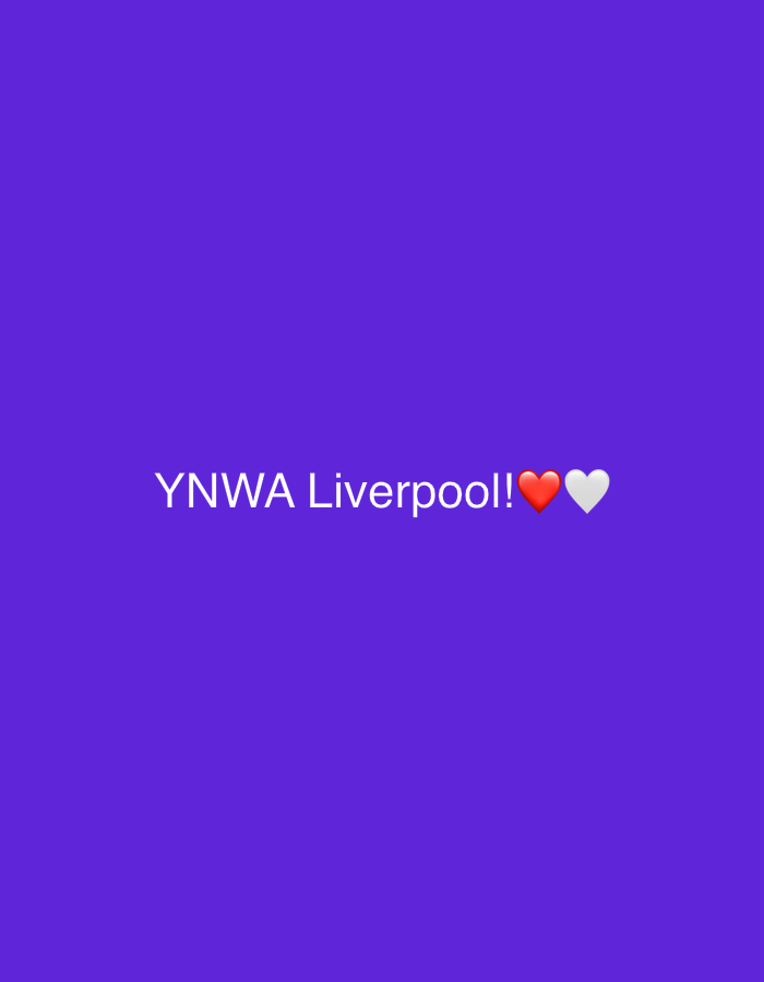 The image is a digital graphic featuring white text centered on a plain, solid purple background. The text reads "YNWA Liverpool!!" followed by a red heart emoji and a white heart emoji. "YNWA" is an acronym commonly associated with Liverpool Football Club, standing for "You'll Never Walk Alone." The hearts symbolize affection or support for the club. There are no other subjects, objects, or activities depicted in the image. The background is a uniform shade of purple, providing a simple and uncluttered setting for the text and emojis. No specific time of day, weather, or real-world location cues are visible within the image content, which is a generic digital message. The provided location context is Razlog, Bulgaria, though this is not visually represented in the digital graphic itself.