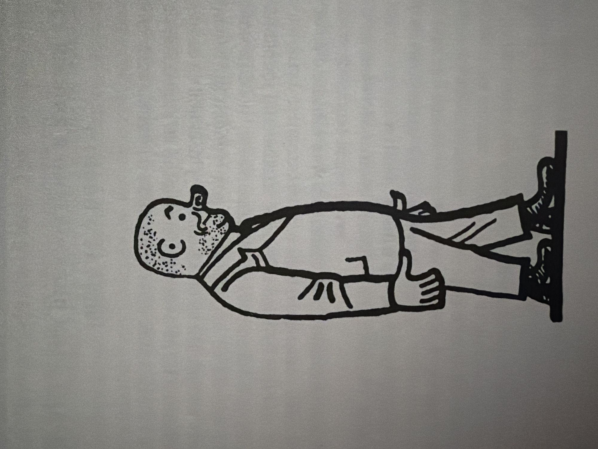 The image is a black and white drawing of a bald, overweight man walking to the right. He is wearing a suit with a vest and has a large nose. The man is depicted in a cartoonish style. The background is a plain, light gray surface. There is no information in the image to suggest any connection to the city of Pazardzhik, Bulgaria.