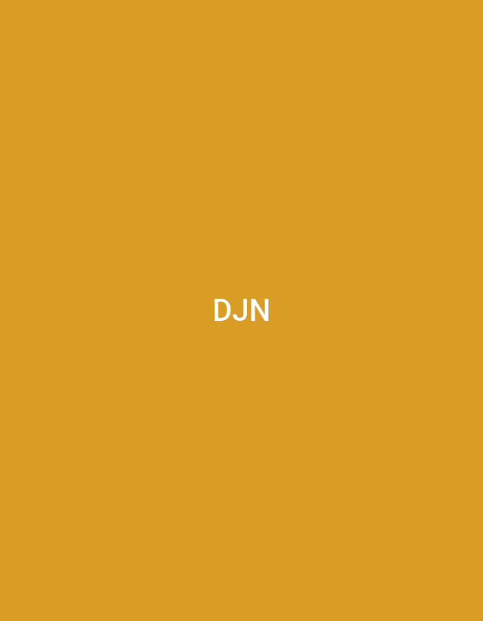 The image, associated with the city of Casablanca, Morocco, presents a flat, abstract graphic. The dominant feature is a solid, uniform background in a medium-gold or mustard yellow hue. Centrally positioned on this background are the capital letters "DJN" rendered in a clear, white, sans-serif typeface. No other subjects, objects, people, or environmental features are discernible within the image; it consists solely of this colored background and white text.