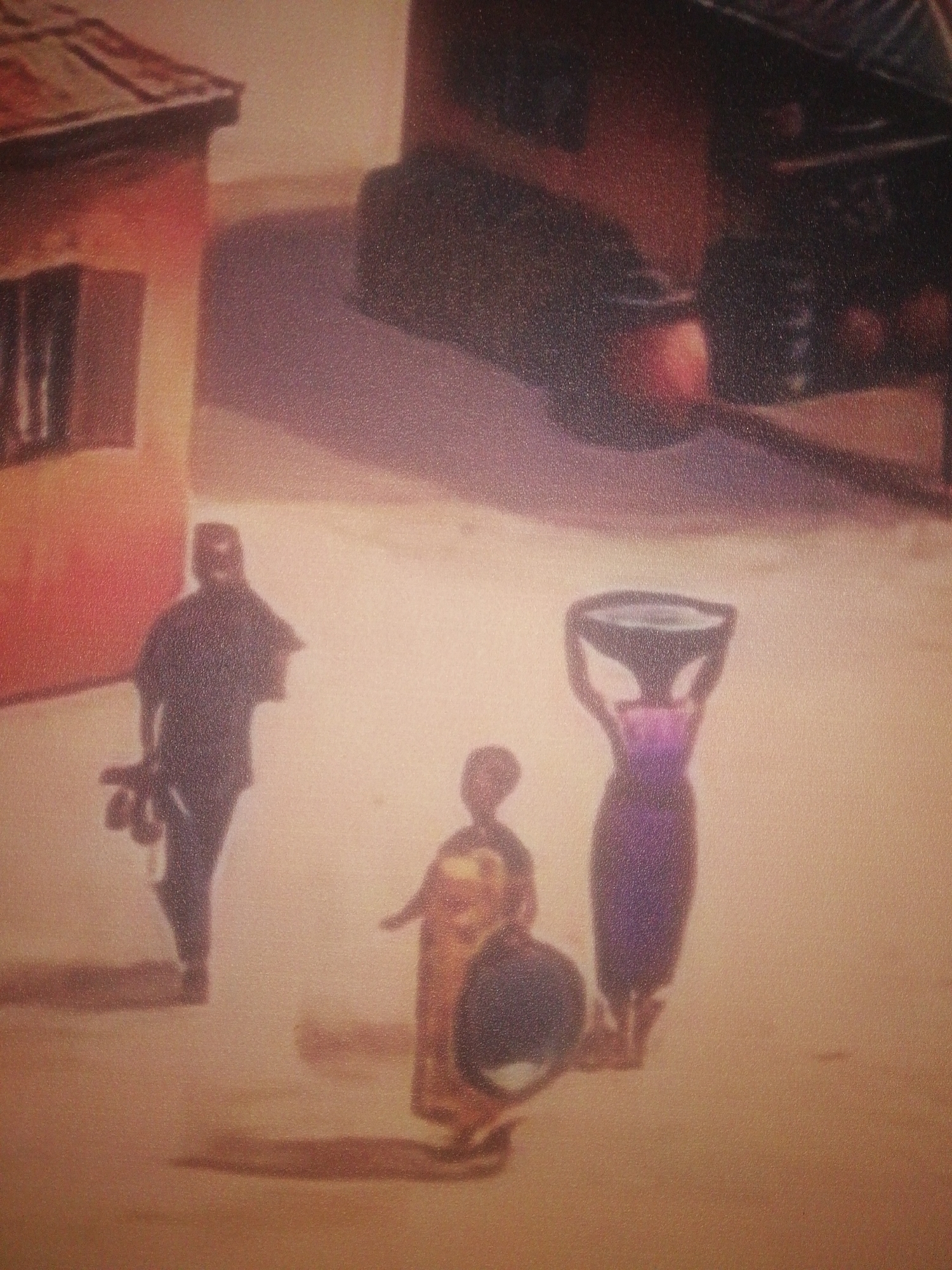 The image depicts a scene in Ikorodu, Nigeria. There are three figures: a man on the left carrying items, a child in the center holding a smaller object, and a woman on the right carrying a bowl on her head. They are standing on what appears to be a road or open area. Buildings are visible in the background.