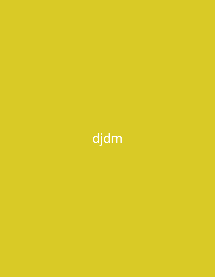 A white text overlay reads "djdm" in the center of a solid yellow background. The background is uniformly colored with no discernible features or context. There are no people, objects, or environmental elements present in the image, aside from the text. The location in the city of Nsugpe, Nigeria, is not visually represented or implied by the image content.