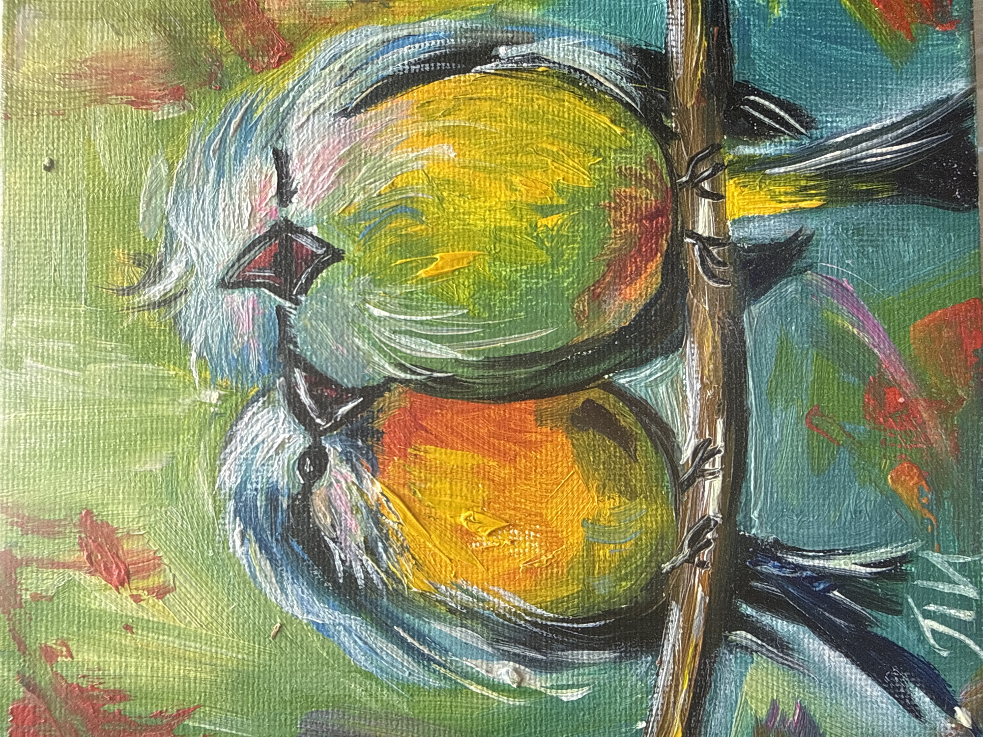 This is a close-up, impressionistic painting of two small birds perched on a branch. The birds appear to be facing each other and are painted with vibrant, thick brushstrokes, predominantly in shades of yellow, orange, and blue with touches of white and black. The one on top has a yellow and green body with blue and white accents around its head, and a small red and black beak. The bird below has a more orange and yellow body with blue and white feathering. Both birds are rendered with simplified shapes, focusing on color and texture. They are perched on a thin, brown branch that runs vertically through the center of the painting. The background is a textured mix of greens and blues, suggesting foliage or a sky, with hints of red and orange abstract shapes that could represent flowers or leaves. The overall mood is lively and cheerful, conveyed through the bright colors and energetic application of paint. A signature, possibly "VIC," is visible in white brushstrokes on the right side of the painting. The artwork does not explicitly suggest a specific time of day or weather conditions, beyond what is implied by the colors of nature. The location context of Sochi, Russia, does not offer specific visual cues within the artwork itself.