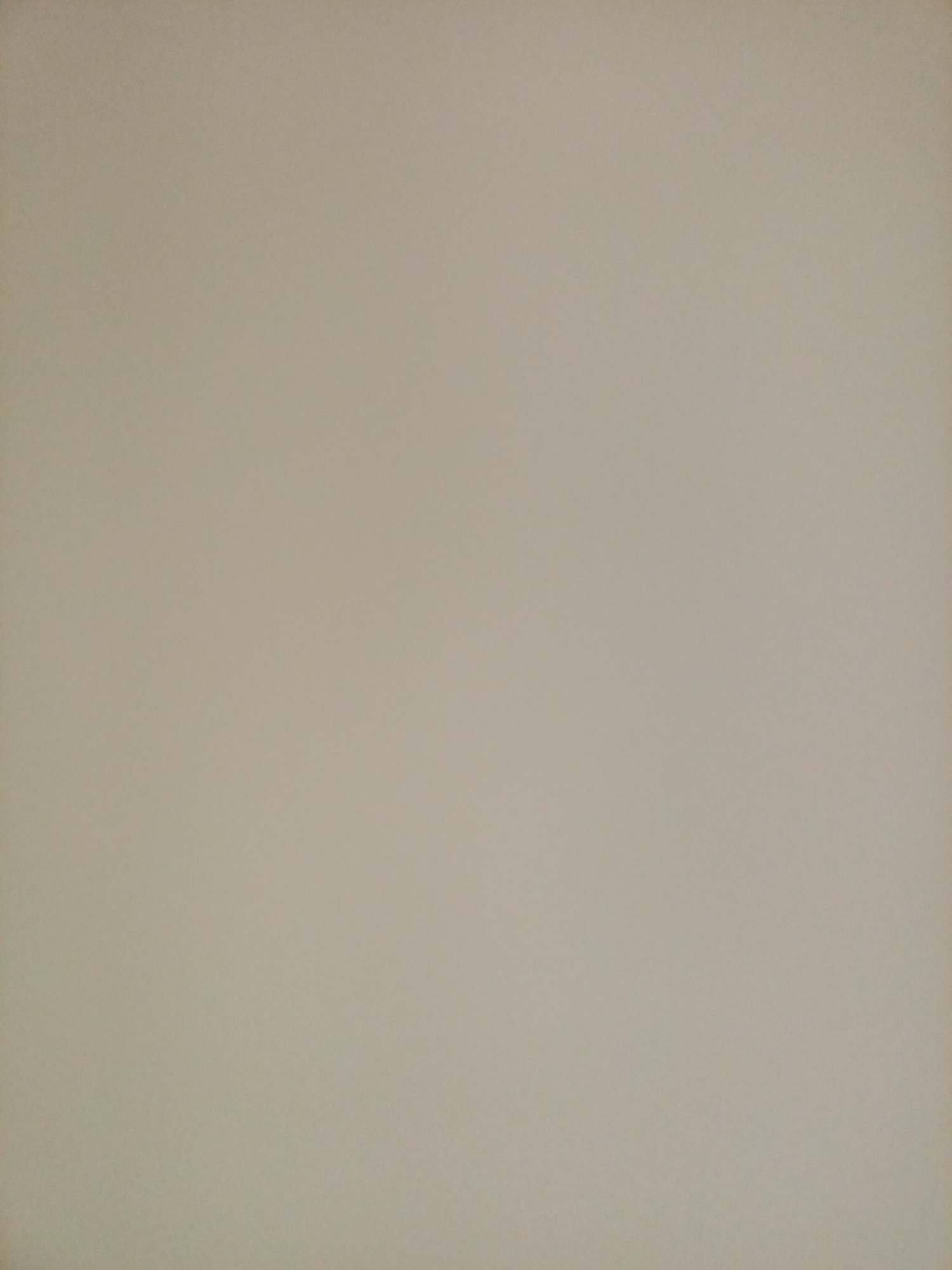 The image is a flat, textured surface, likely a wall or a sheet of paper, with a light beige or off-white color. The texture appears to be slightly grainy, with subtle variations in shading across the surface, possibly due to lighting or the material itself. There are no discernible objects, people, or discernible features within the frame. The image provides no information about its location in Rostov-on-Don, Russia, or any context related to the city.
