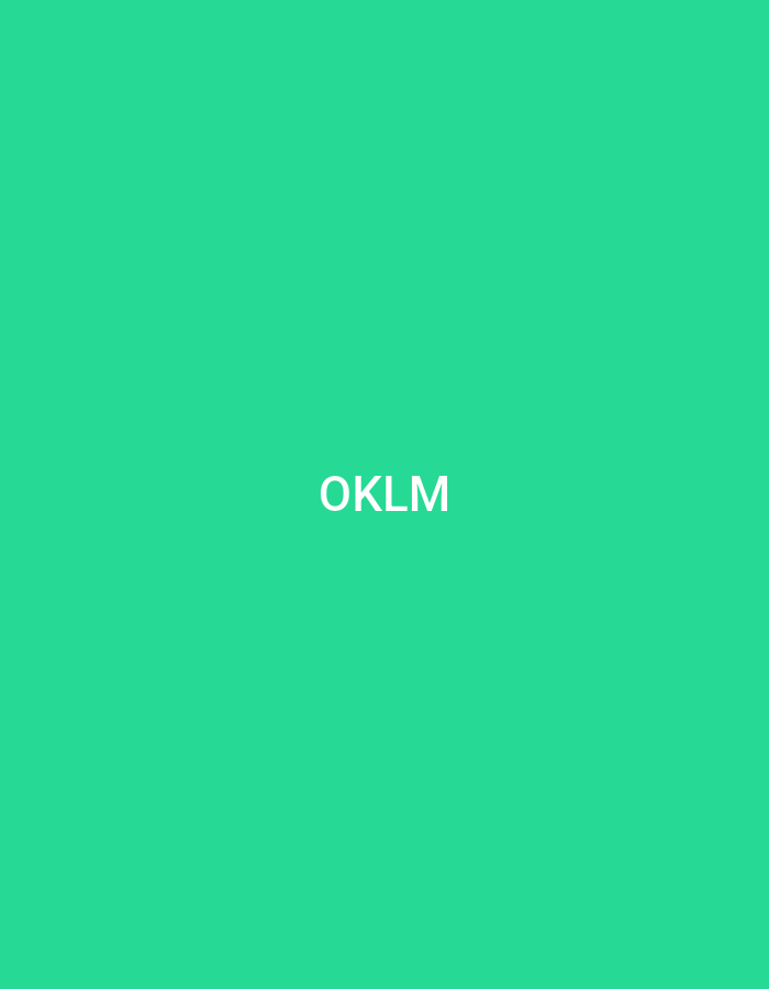 The image displays a plain, vibrant green background. Centered horizontally and vertically on this background are four white uppercase letters: "OKLM." The letters appear to be a sans-serif typeface. No other elements, subjects, or actions are present. The scene is a digital graphic with no discernible features, objects, people, or environmental context that would indicate a specific physical location, including Casablanca, Morocco.