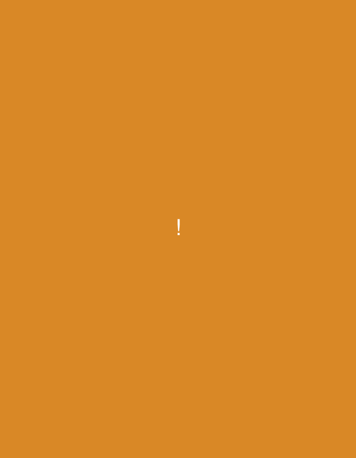 This is a photograph of a solid orange-colored background with a single white exclamation mark located in the center of the frame. The image does not depict any specific location in the city of Okha, Russia, nor does it contain any people, subjects, objects, actions, or interactions. The environment is entirely abstract.