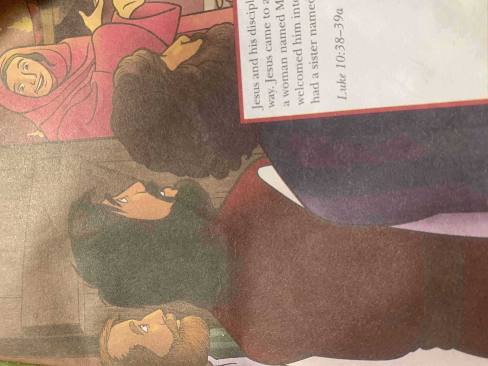 This is an illustration depicting a scene from a biblical story. In the foreground, the heads and shoulders of three people are visible, drawn in a somewhat stylized manner with warm skin tones and dark hair. They are dressed in earth-toned and reddish-brown garments. The figures appear to be engaged in conversation or listening, with one person looking upwards and another slightly to the side.
Behind them, another figure is shown, wearing a vibrant pink robe and a head covering. This person's face is clearly visible, with wide eyes and an open mouth, suggesting surprise or engagement. This figure is resting on their side, with one hand raised. To the right, a large expanse of dark fabric or shadow dominates the upper portion of the image, partially obscuring another figure.
A card with text is placed at an angle over the illustration, obscuring parts of the figures. The visible text reads: "Jesus and his discipl / way. Jesus came to a / a woman named M / welcomed him into / had a sister named / Luke 10:38–39a". The style of the illustration suggests it is from a children's book or a religious publication. The context provided mentions Jauro Yinu, Nigeria, which could be a location where this story is being shared. There are no clear indicators of time of day or weather.