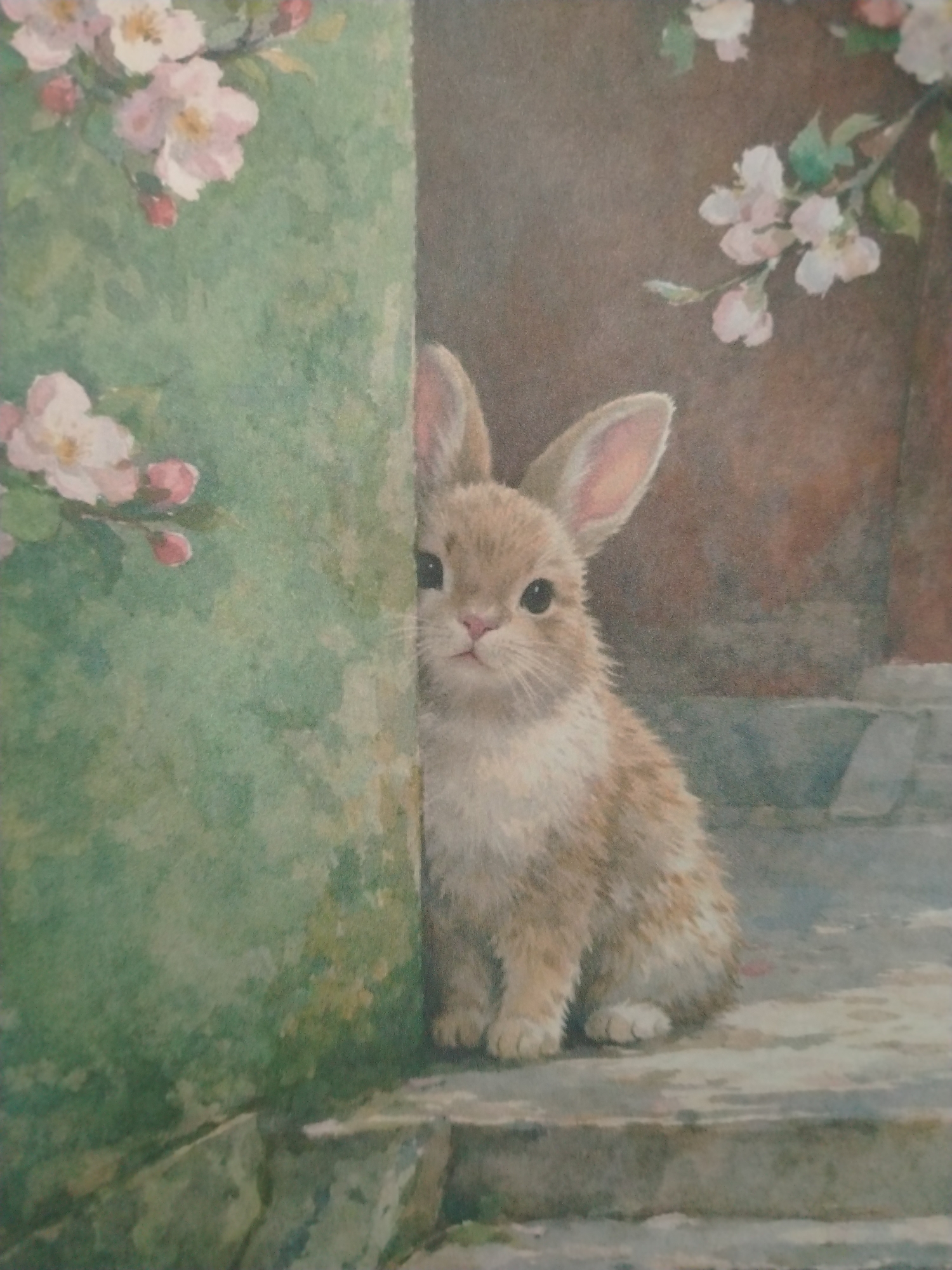A watercolor painting depicts a young rabbit peeking out from behind a textured green surface, possibly a wall or a large, overgrown plant. The rabbit, with its light brown fur and pink inner ears, is positioned to the right of the frame, with its body mostly concealed. Its face is turned towards the viewer, revealing large dark eyes, a small pink nose, and white whiskers.
The background is a muted brown, with hints of what appear to be blossoming branches and soft pink flowers. To the left of the rabbit, the green surface is adorned with more delicate pink blossoms and buds, suggesting a springtime or garden setting. The ground beneath the rabbit is rendered as stone steps or paving, with variations in color and texture.
The overall impression is one of gentle curiosity and innocence. The painting's artistic style is soft and impressionistic, with visible brushstrokes and a muted color palette. There is no indication of a specific location in the city of Shaki, Azerbaijan, within the artwork itself.