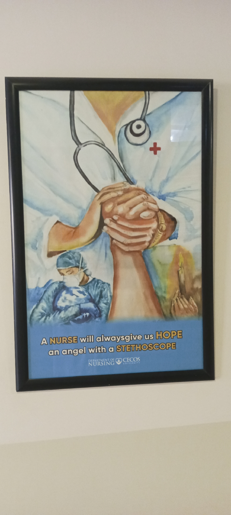 A framed poster hangs on a light-colored wall. The poster depicts a watercolor-style illustration featuring a nurse in scrubs with a stethoscope, holding hands with a patient. The text reads "A NURSE will always give us HOPE an angel with a STETHOSCOPE," with the "Department of Nursing" and "CECOS University" logos displayed at the bottom. This poster is likely located within the city of Peshawar City Tehsil, Pakistan, given the university logo.
