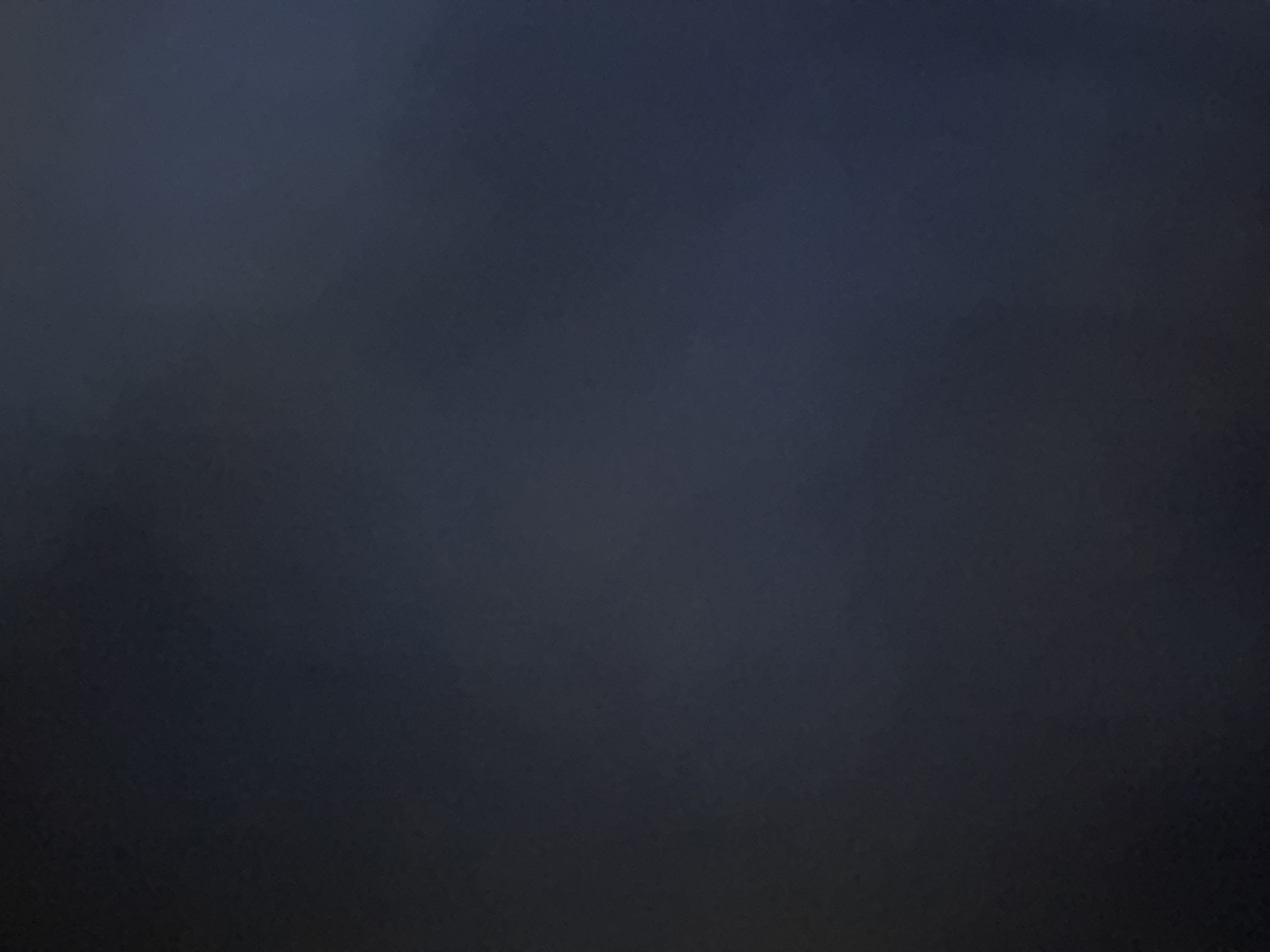 The image displays a uniform field of very dark grayish-blue. The overall impression is one of extreme low light or a dark, unlit surface. There is a subtle, slightly grainy or mottled texture throughout, suggesting a fabric, wall, or perhaps an underexposed environment. No discernible subjects, objects, people, or specific scenes are visible within the frame. There is no activity taking place, nor is any visible text present. Due to the profound darkness and lack of specific visual information, it is impossible to determine the time of day, weather conditions, or any specific location cues related to Yerevan, Armenia, from the image itself. The crops provided further emphasize the consistent dark color and texture across different sections of the original image.