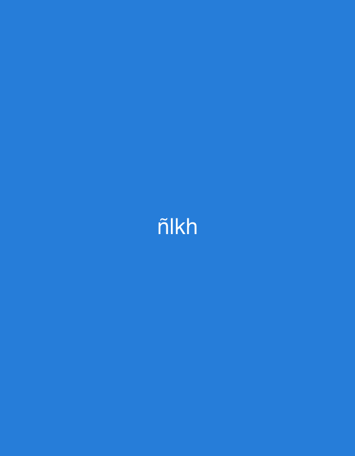 The image displays a uniform, solid blue background, serving as a monochromatic field. Centered both horizontally and vertically on this blue background is a single, four-character word in white, sans-serif text: "ñlkh". The first character, 'ñ', features a tilde above the 'n'. No other elements, figures, objects, or environmental details are present in the image. The scene offers no visual information to determine any geographic location, including the city of Casablanca, Morocco.