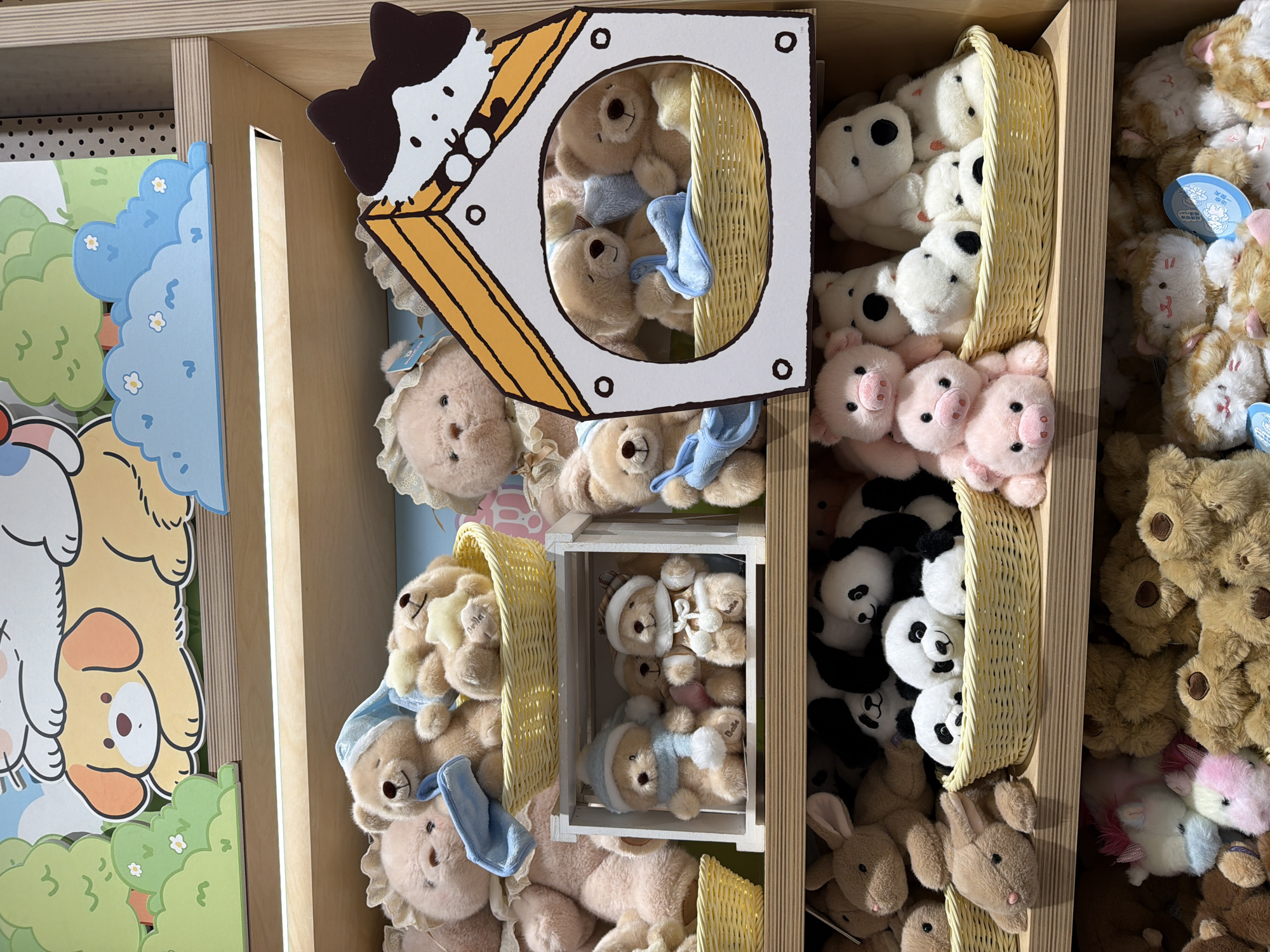 The image shows shelves in a store, likely in Chongqing High-tech Zone, China, filled with plush toys. The toys include teddy bears with bonnets, puppies, pink pigs, white dogs with black spots, pandas, bunnies, and unicorn-like creatures. Many are arranged in wicker baskets or small wooden crates. Some shelves are decorated with cartoon figures such as dogs and cats.