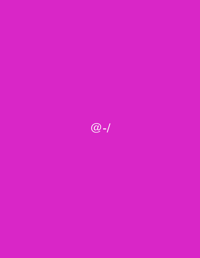 The image displays a solid magenta background with no discernible scene, people, or objects other than text. Centered on this vibrant, uniform color field is the white text string "@-/". The font appears to be sans-serif. There is no activity taking place, nor are there any environmental details such as time of day, weather, or specific location cues visible within the image itself. The context for the location is provided as Ihtiman, Bulgaria. The image is minimalist, focusing solely on the bold color and the symbolic text.