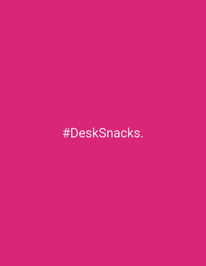 The image shows the text "#DeskSnacks." in white on a solid magenta background. There is no indication of Riga, Latvia, or any other city or environment in the image. There are no people, objects, actions, or interactions in the image besides the text.