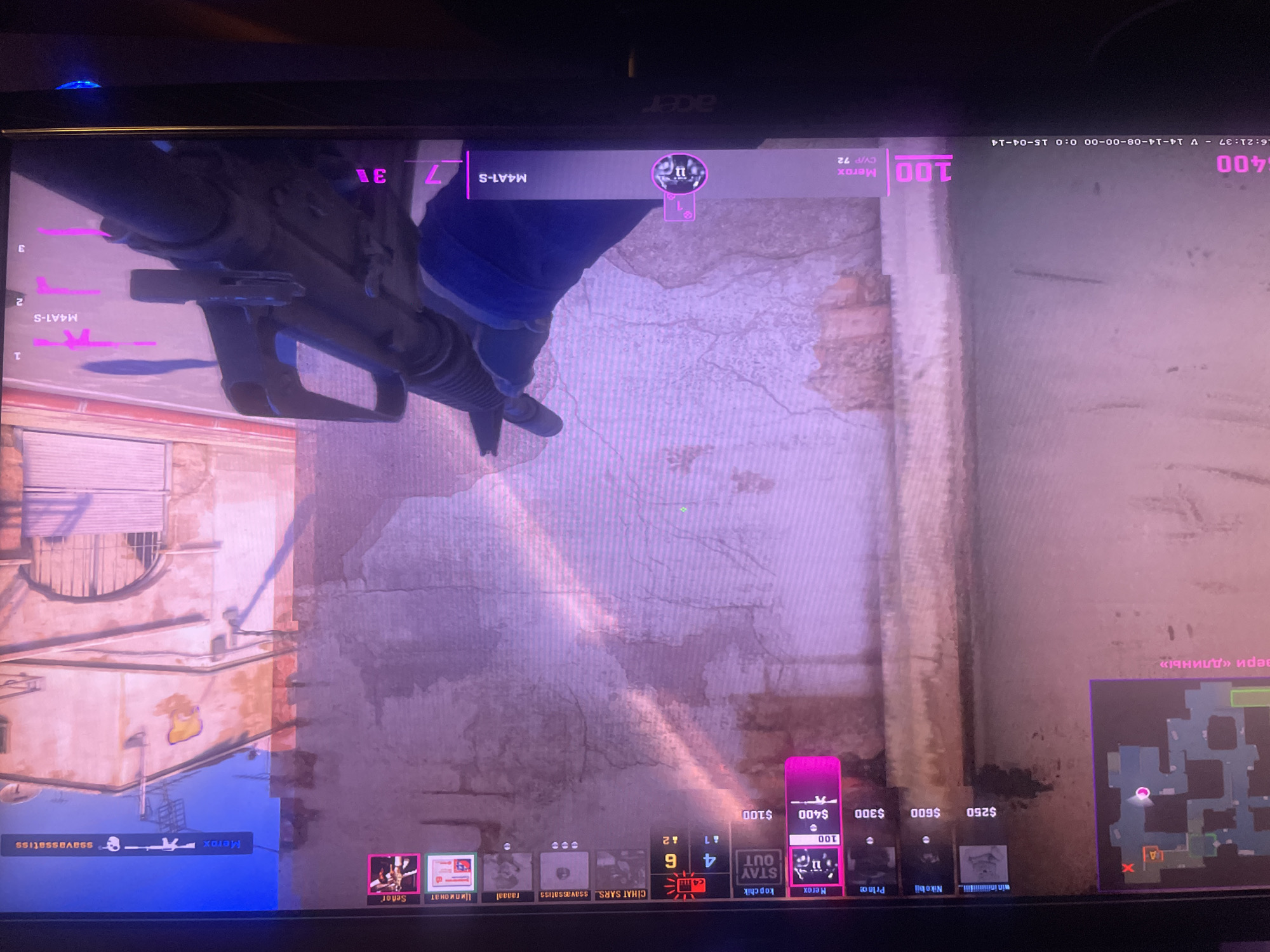 The image appears to be a photograph of a computer screen displaying a first-person perspective of a Counter-Strike: Global Offensive (CS:GO) game. The player is holding an M4A1-S weapon, and the heads-up display (HUD) shows game information such as player names (Merox, kopchik, Prince, Nike bij, CİHAT SARS, ssavassatiss, raaaal, Ципионат, Señor), player statistics (CV/P 72), money ($400, $100, $250, $600, $300), bomb status, and the time. The minimap in the lower right indicates player positions. The environment appears to be a textured wall and some brick buildings. The OCR data does not mention the city of Lachendorf, Germany.
