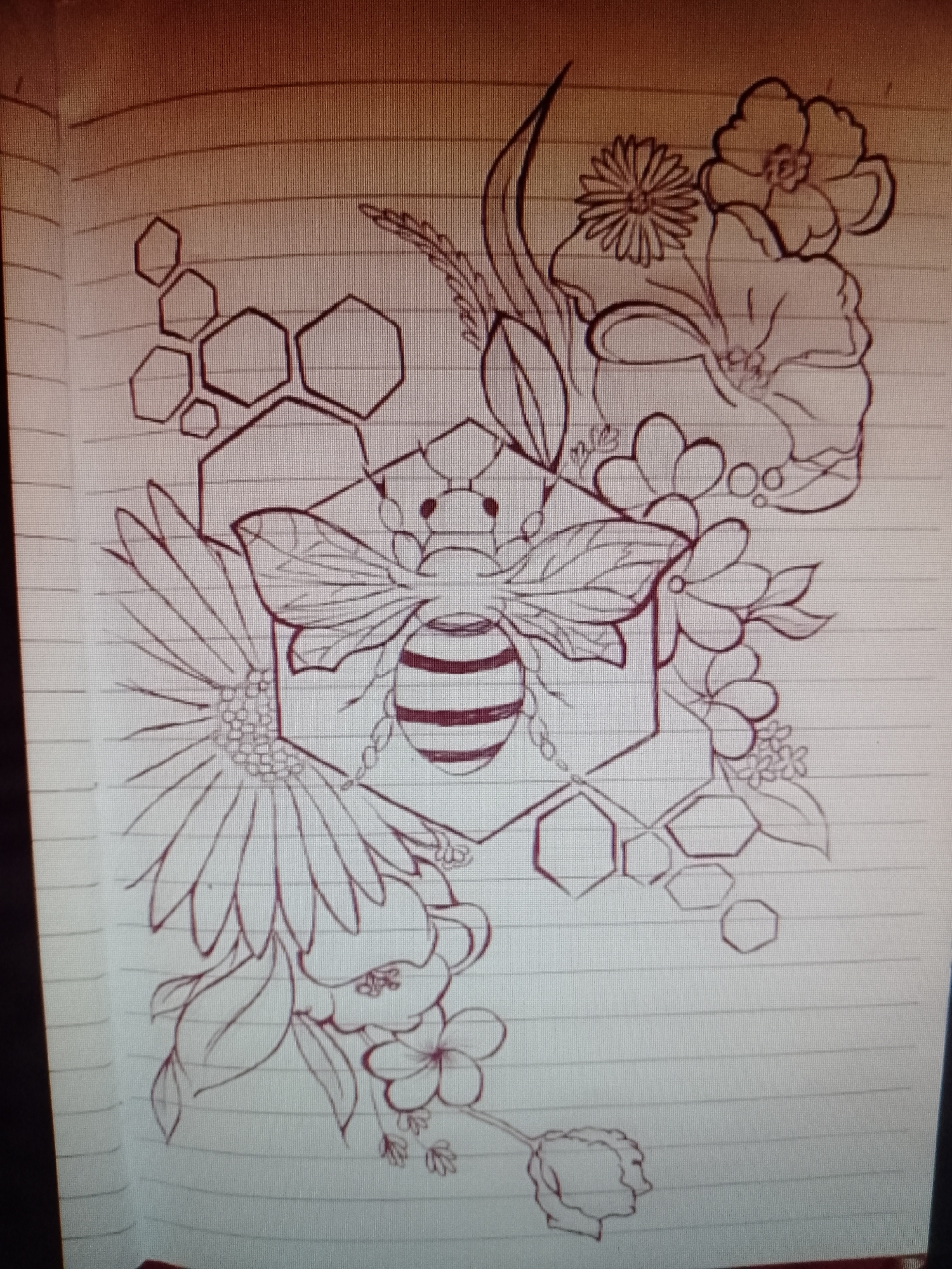 The image is a drawing on lined paper. The drawing depicts a bee positioned in the center, superimposed over a hexagon made of honeycomb cells. The bee has wings and striped abdomen. The composition includes floral elements surrounding the bee and honeycomb structure. The flowers vary in shape and size and are arranged around the central bee and honeycomb motif.