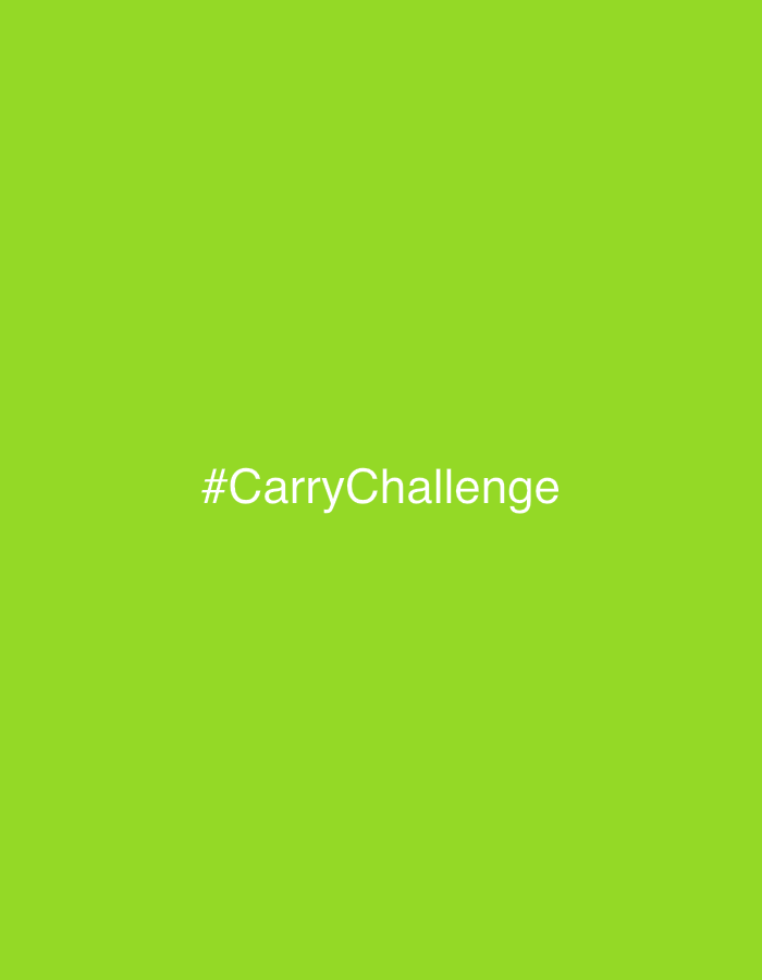 The image displays a graphic with a solid, vibrant lime green background. Centered both horizontally and vertically on this background is white text. The text reads "#CarryChallenge" and is presented in a clean, sans-serif font. There are no people, objects, or specific scenes depicted within the image. No activity or event is visible. The bright green color is the dominant visual element, providing a stark contrast to the white text. There are no notable details regarding time of day, weather, or explicit location cues within the image itself. The image appears to be a digital title card or promotional graphic. The provided location context of Izhevsk, Russia, is not visually represented in the content of the image.