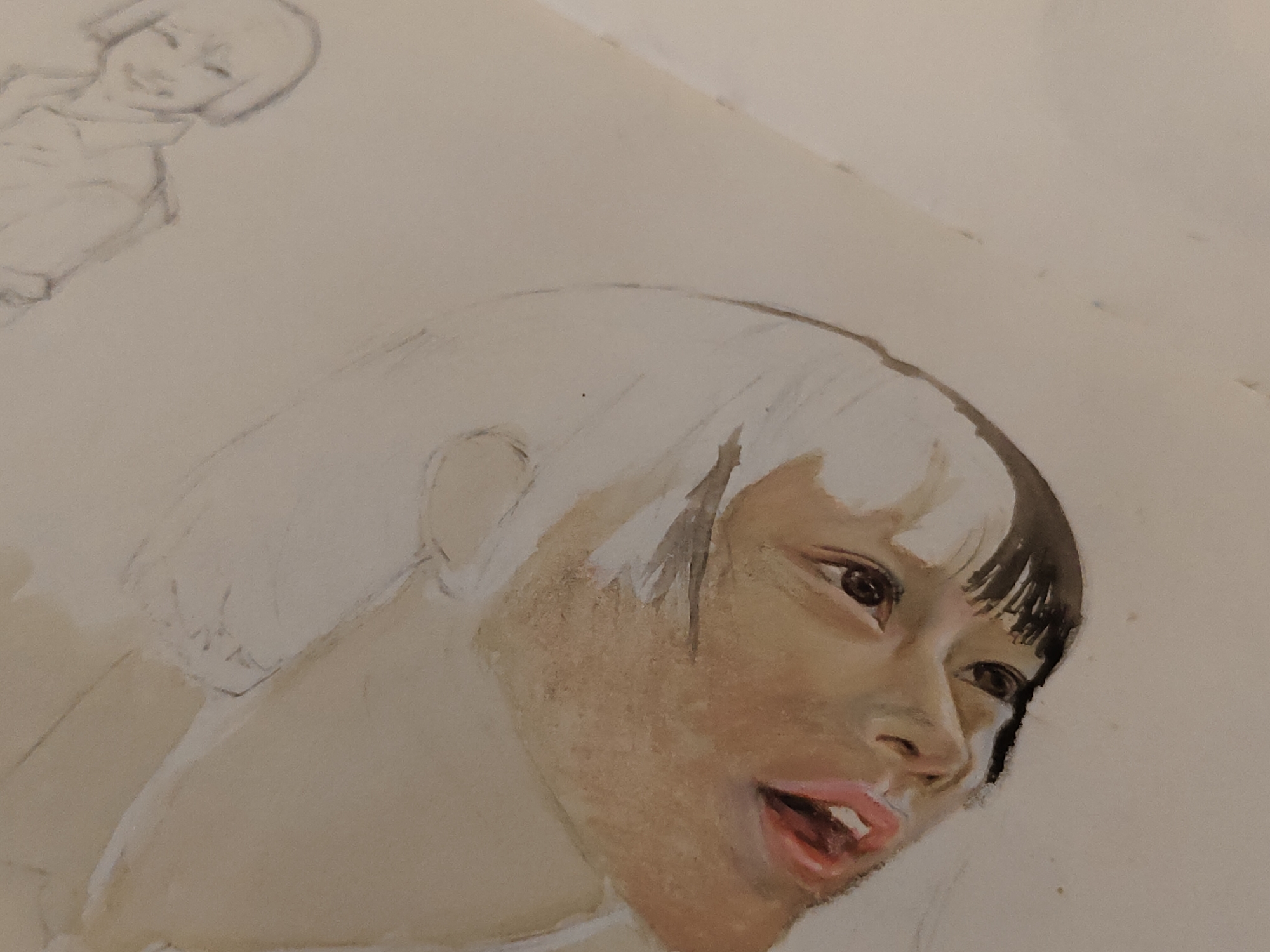 The image displays a close-up photograph of an unfinished artwork on light-colored paper. The primary subject is a portrait of a person, likely female, rendered in a three-quarter profile, looking upwards and to the viewer's right. The face is partially painted with skin tones ranging from light brown to darker tan, exhibiting varied brushwork. The eyes are dark brown with distinct highlights. The lips are parted, revealing upper teeth and a pinkish-red tongue. The hair on the left side of the face (viewer's left) is painted dark brown/black in a segmented style, while the hair on the right side of the face and the majority of the head and shoulder area remain as uncolored pencil outlines on the paper. In the upper left quadrant of the image, a lighter, less detailed pencil sketch of another smiling figure with short hair and visible torso is present. The artwork appears to utilize pencil for initial sketching and a wet medium, such as watercolor or gouache, for the colored portions. No environmental details beyond the paper itself are discernible, and there are no visual cues within the image to suggest a specific location in Davao City, Philippines, or any other geographic location.