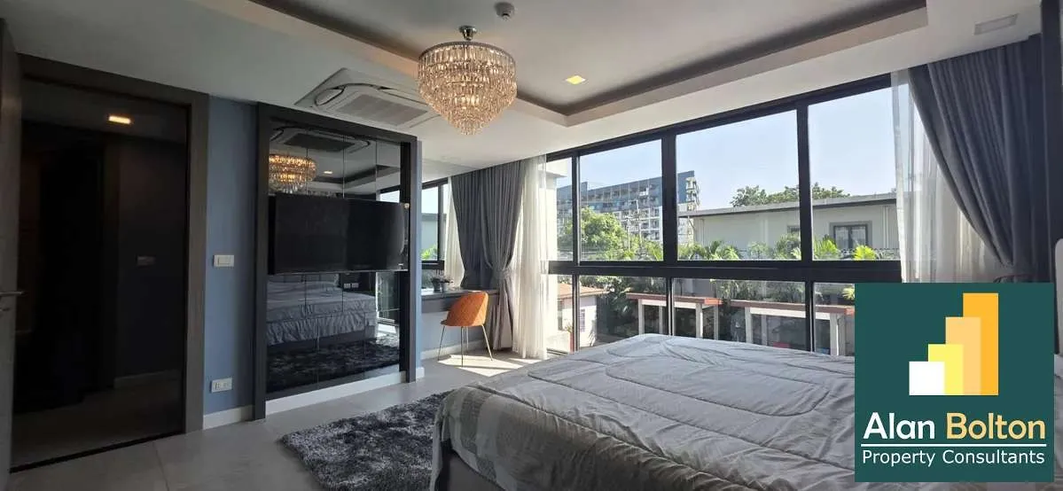 Modern 3-Bedroom Condo at Serenity Residence Jomtien | Pool View photo 9