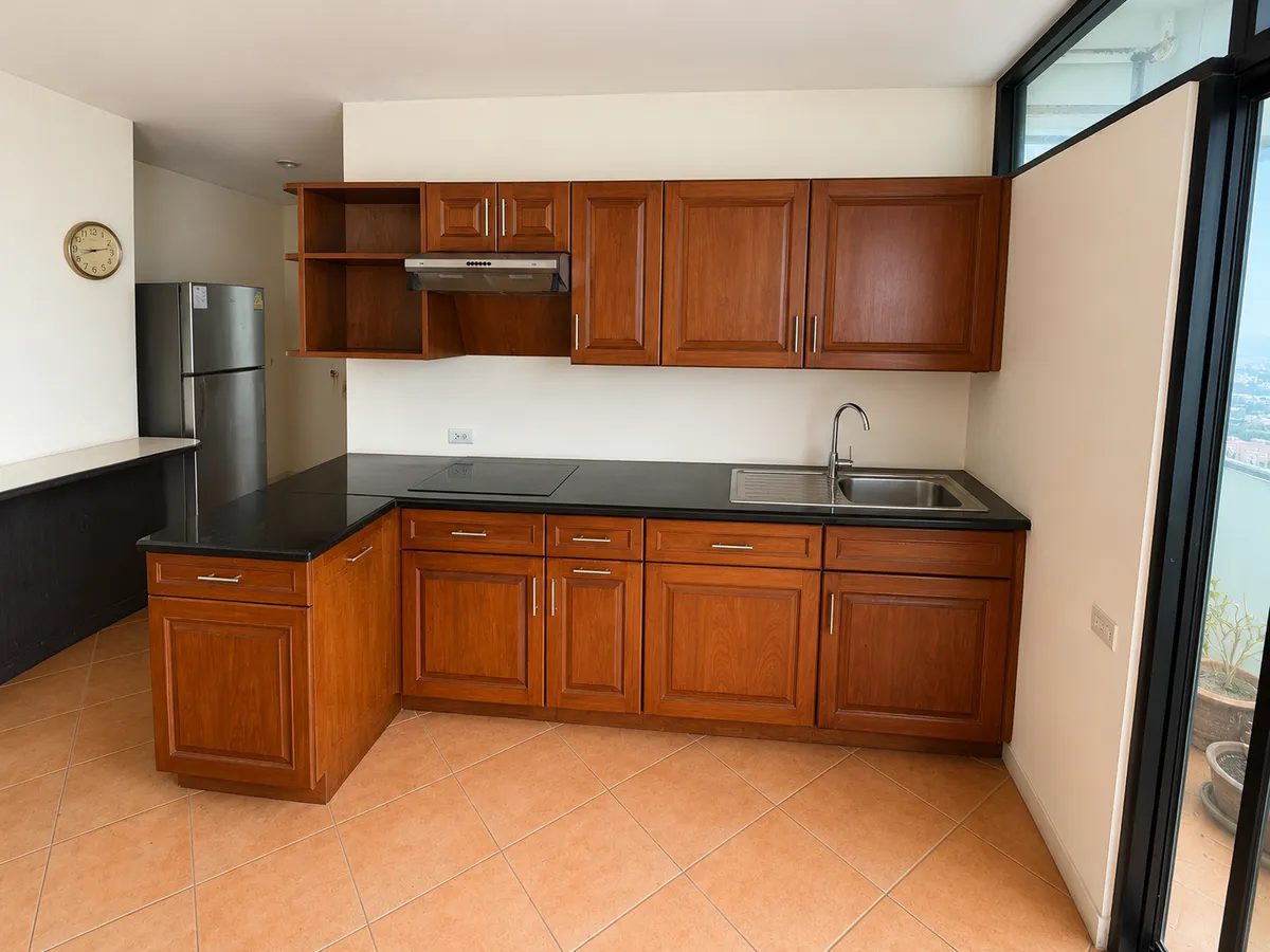Spacious Two-Bedroom Two Bathroom Corner Unit on a High Floor In Need of Complete Renovation in Popular Jomtien Condominium photo 3