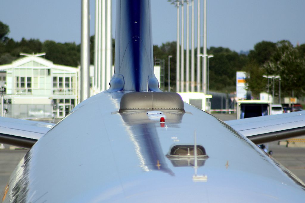 Detail of a Starlink SATCOM antenna on the fuselage of a Lufthansa Airbus A330-300 aircraft.