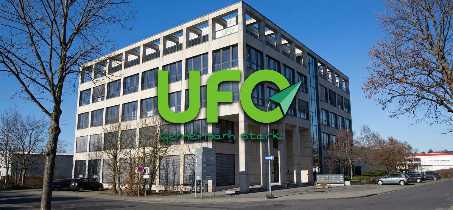 Modern UFG office building with large green "UFO Gemeinsam stark" logo
