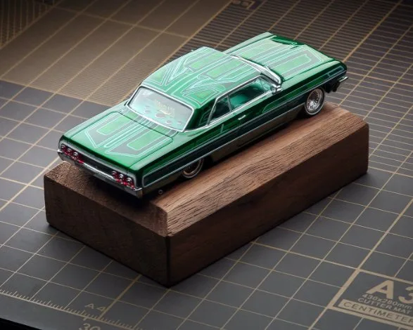 97M 1:64 Chevrolet Impala Lowrider. Green with graphics