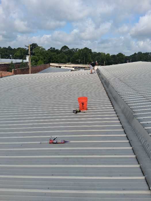 Replacing metal roofing screws with oversized in Magee, MS, photo 2