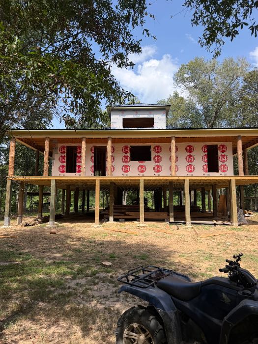 New constructionputting up Cedar log columns in Terry, MS
