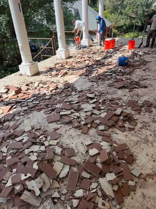 Demoing brick floor pavers in Pearl, MS