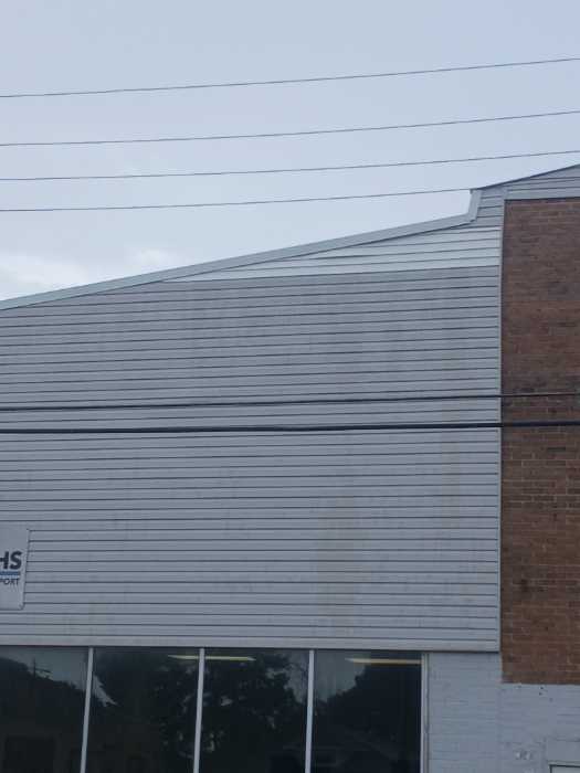 Put gable roof caps on the front and back of the building in Magee, MS, photo 2