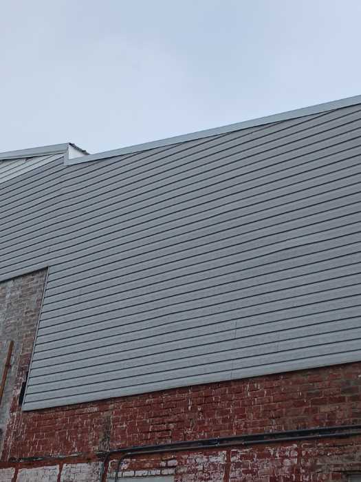 Put gable roof caps on the front and back of the building in Magee, MS, photo 4