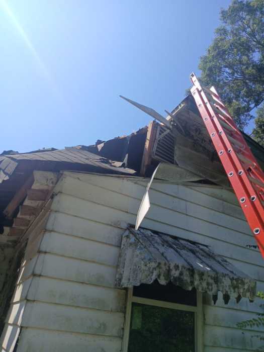 Demoing a damaged roof in Terry, MS