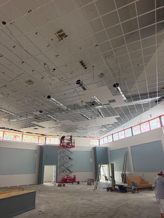 Installing grids for drop ceiling and stone on back wall in Richland, MS