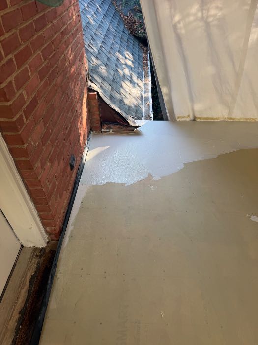 Installing waterproof underlayment for brick patio paver, second floor porch in Pearl, MS, photo 2
