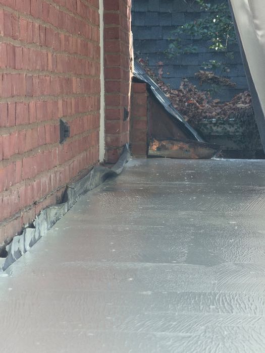 Installing waterproof underlayment for brick patio paver, second floor porch in Pearl, MS, photo 5
