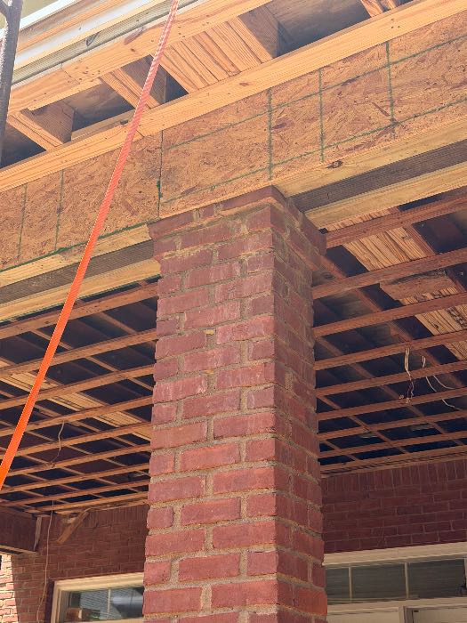 Repaired broken brick on top of corner on wall and top of columns and wing wall on steps in Pearl, MS