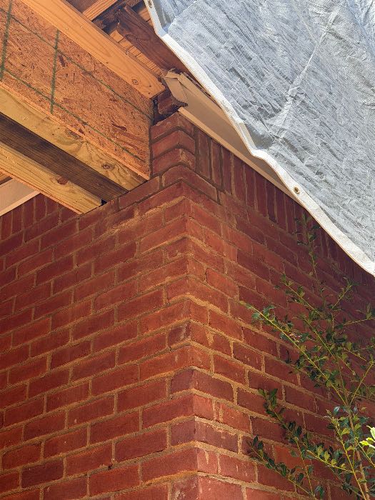 Repaired broken brick on top of corner on wall and top of columns and wing wall on steps in Pearl, MS, photo 3