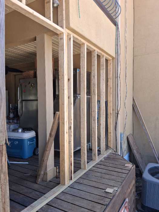 Installing framing on a back deck to turn into a room in Canton, MS, photo 2