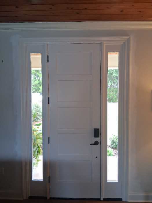 Adjusted door after installation touched up paint skim sheetrock in Gluckstadt, MS