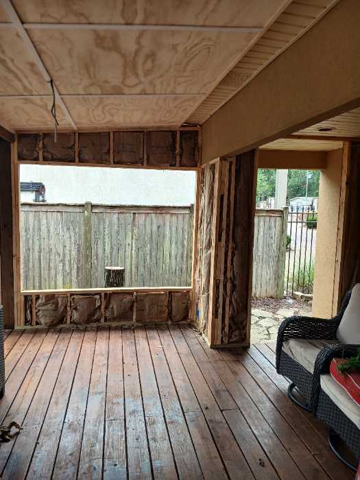 Installing insulation on the back porch in Canton, MS