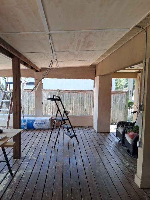 Installing interior paneling when closing in a porch in Brandon, MS
