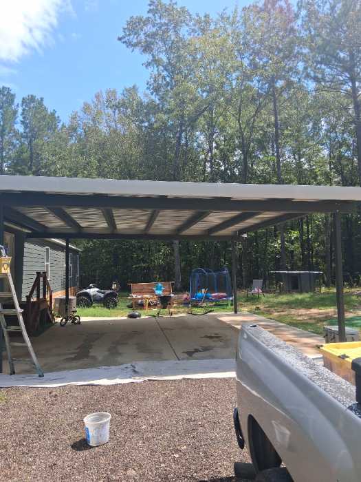 Painting custom color trim to match metal roof install in Florence, MS, photo 5
