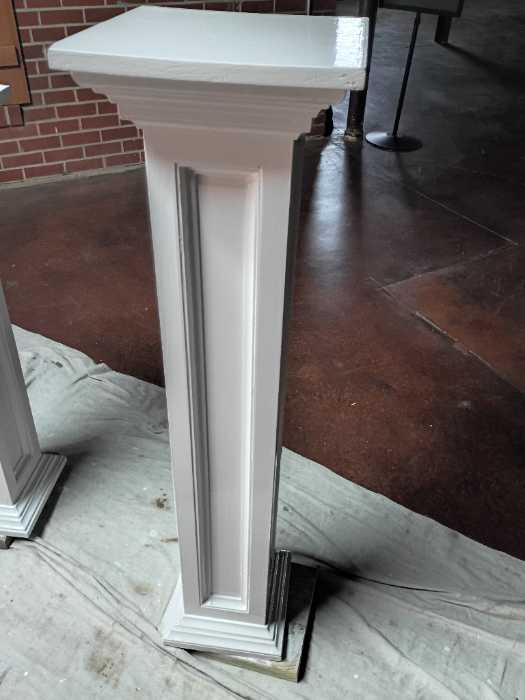 Painting wooden stands in Richland, MS