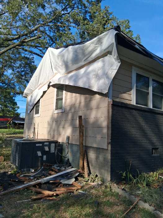 Tree fell damage house putting on temporary roof before roof install in Pearl, MS, photo 4