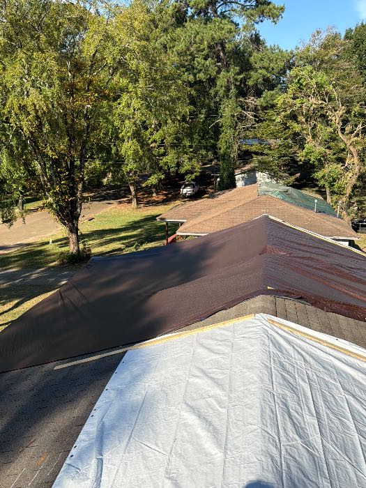 Checking tarp in Pearl, MS