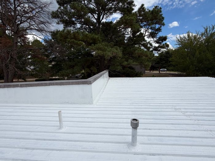 Installed silicone roof system with a pull test in Madison, MS
