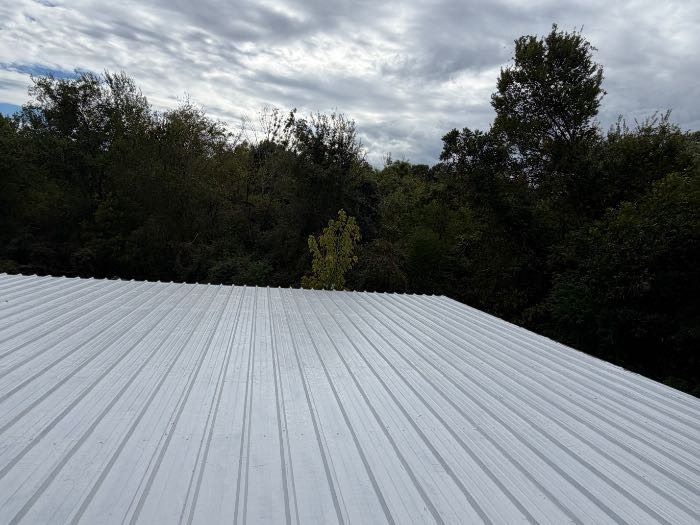 Installed silicone roof system with a pull test in Madison, MS, photo 4
